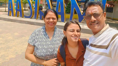 a photo of shrutika baranwal with her parents courtesy the indian