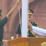 captain sonia singh chauhan assisting pm modi in hoisting the national flag