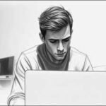 melancholy young man at laptop