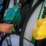 a worker holds a nozzle to pump fuel in a vehicle at a petrol pump in new delhi india may 19 2026