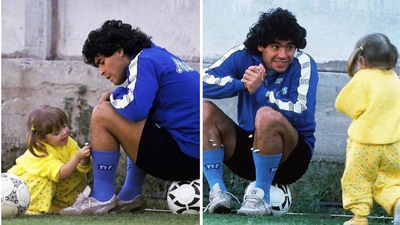 dalma dressed in yellow was seen putting flowers into her fathers socks as he sat on a football and watched her