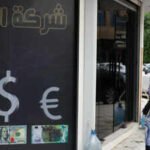 iraq devalues its currency