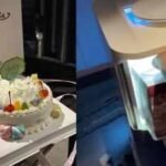 man wakes up to a birthday cake delivered by a robot at a hotel